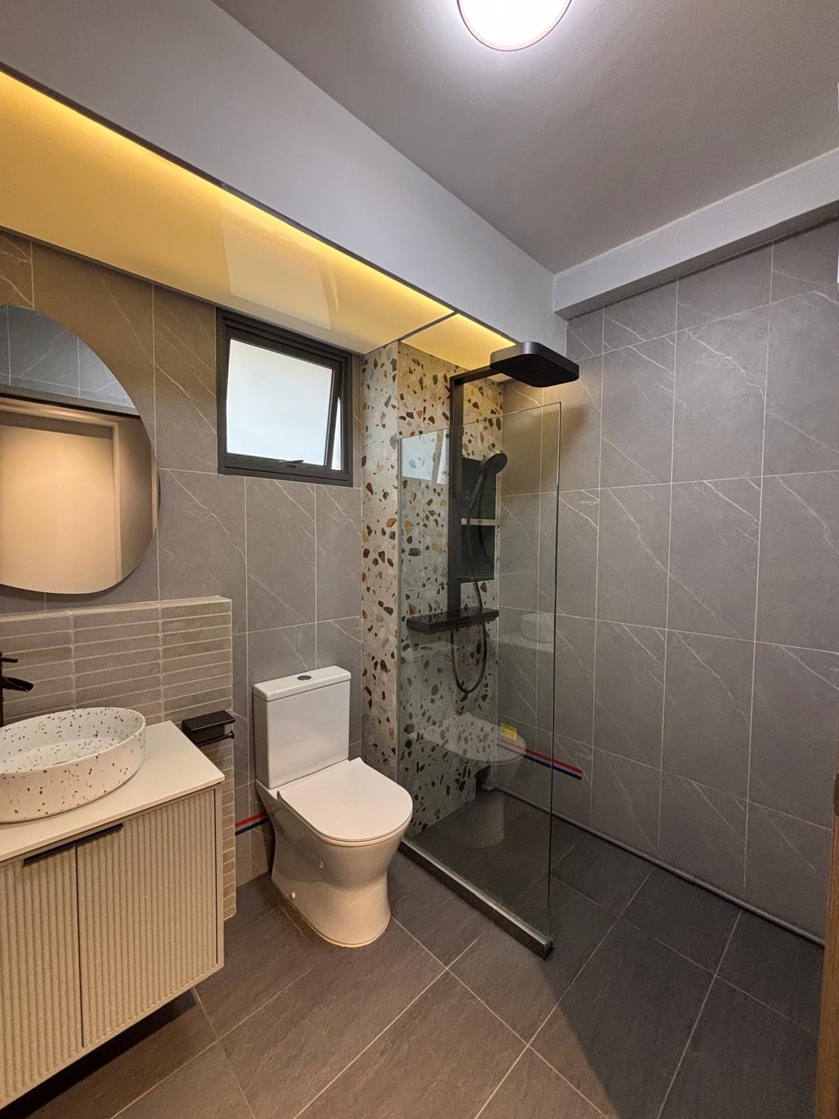 Handover milestone: MYD designer and satisfied Singapore homeowner in a newly completed living room
